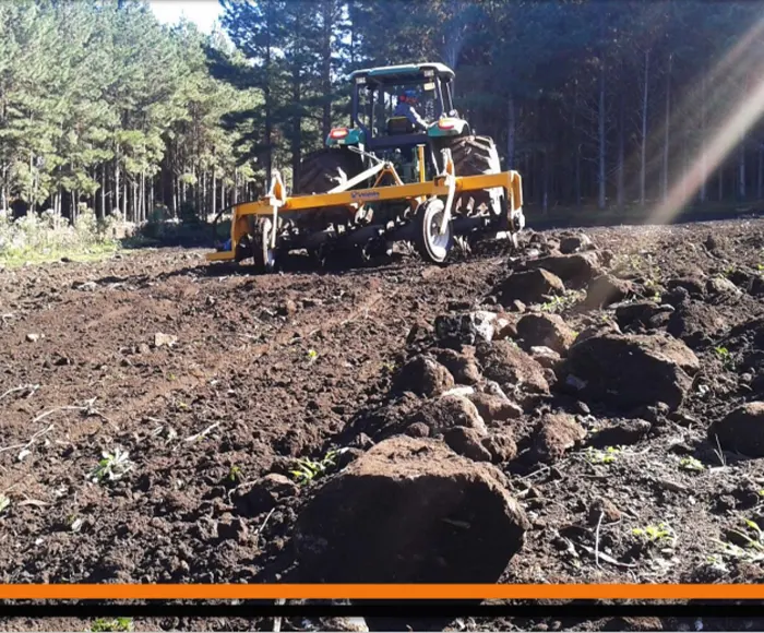 EP-EW-4000 T rock rake clearing stones from Korean hillside farmland before planting